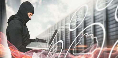 fotolia_105007198_xs https://stock.adobe.com/de/images/side-view-of-hacker-using-laptop-against-blue-glowing-black-background/105007198